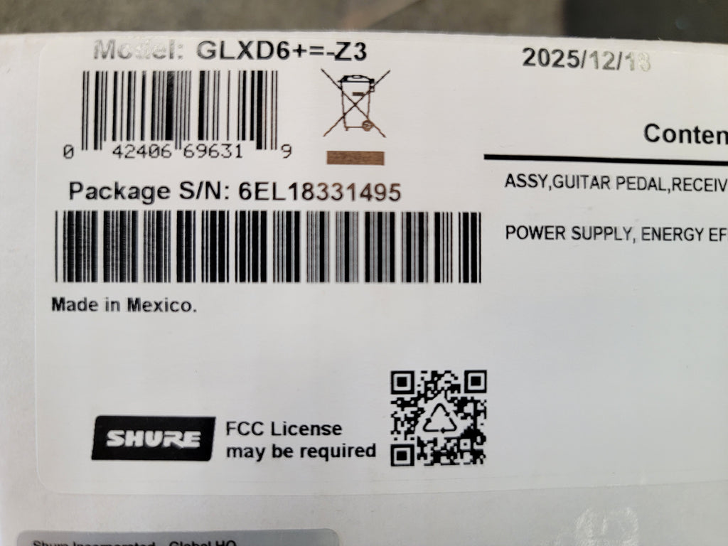 Shure GLXD6+ wireless guitar pedal receiver — retail box and contents