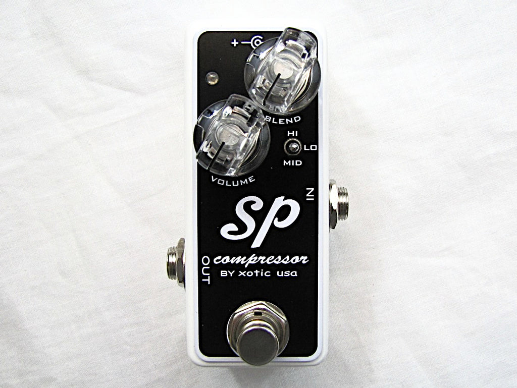 Used Xotic SP Compressor guitar pedal - black body white sides front view