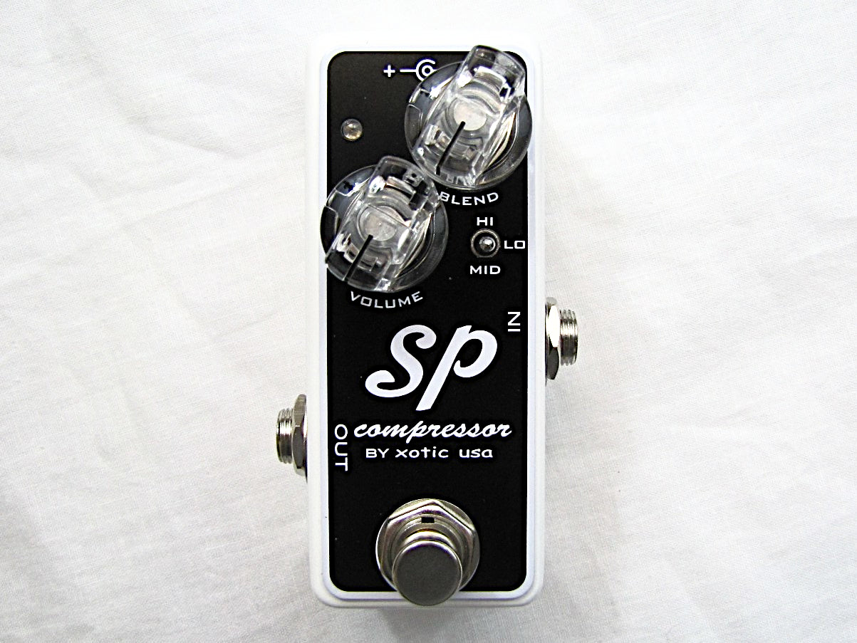 Used Xotic SP Compressor guitar pedal - black body white sides front view