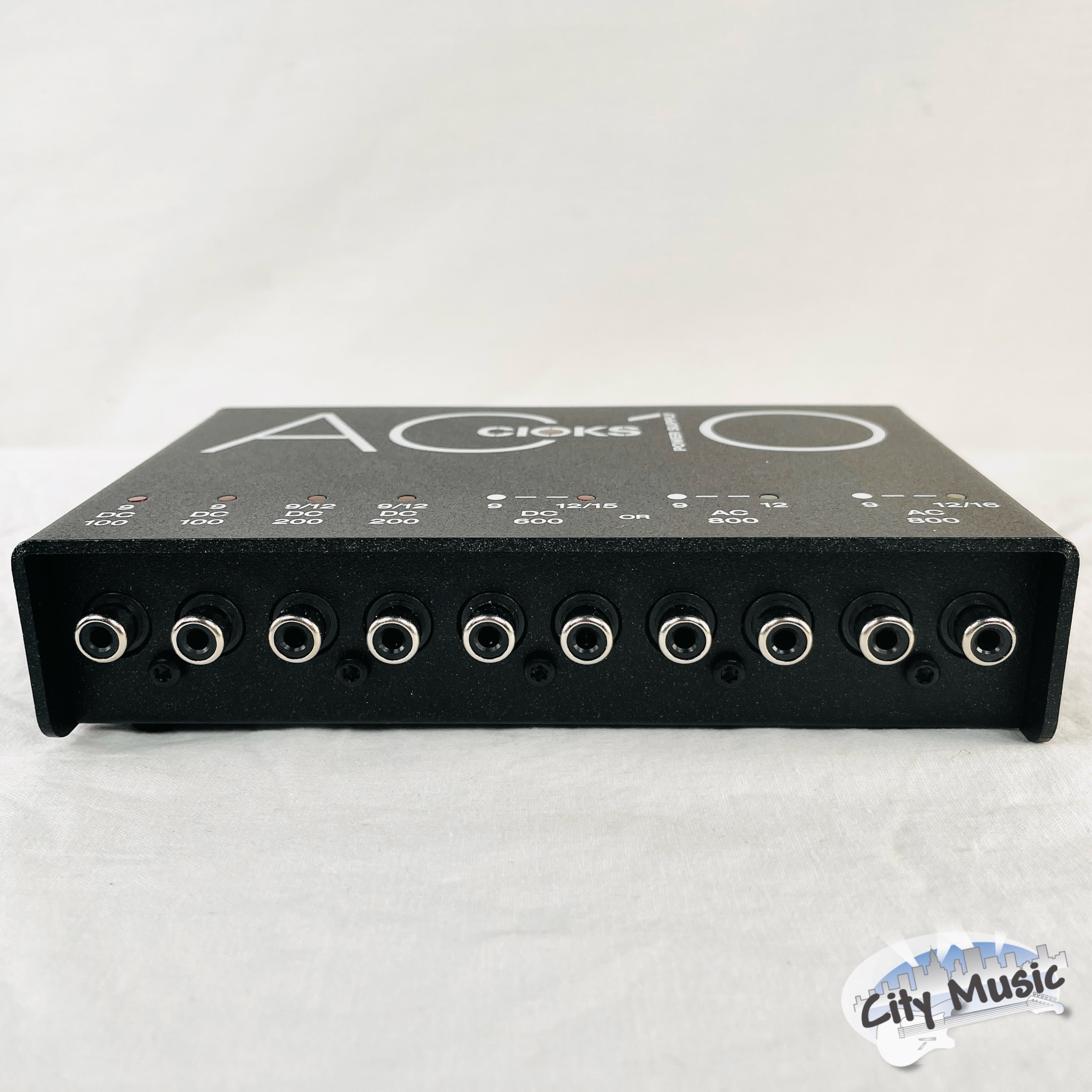 CIOKS AC10 power supply — close-up of DC and AC outputs with metering LEDs