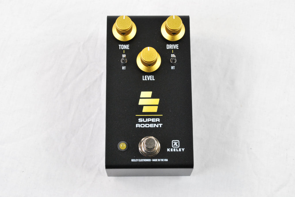 Keeley Super Rodent overdrive distortion pedal — black enclosure with gold knobs, top view