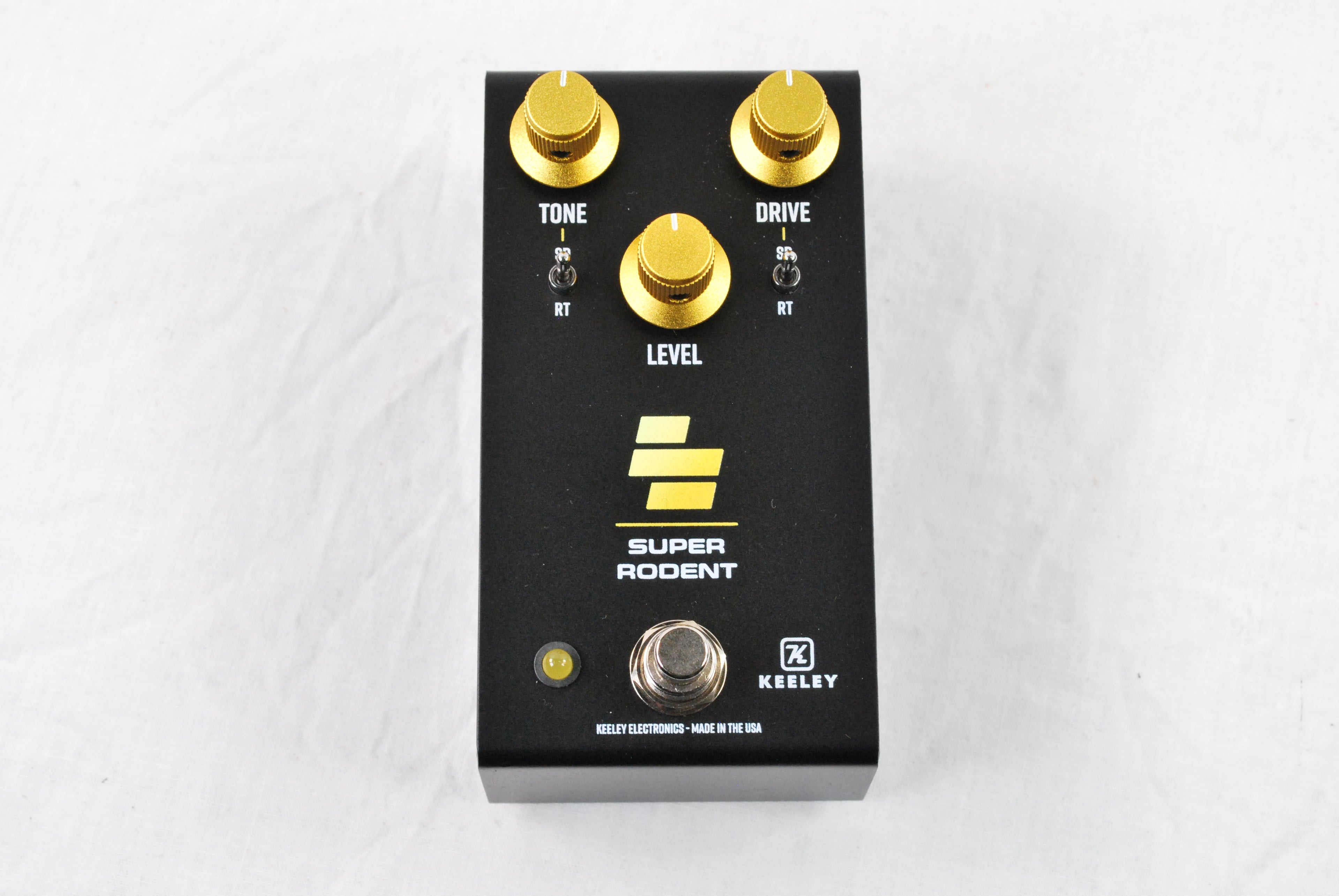 Keeley Super Rodent overdrive distortion pedal — black enclosure with gold knobs, top view