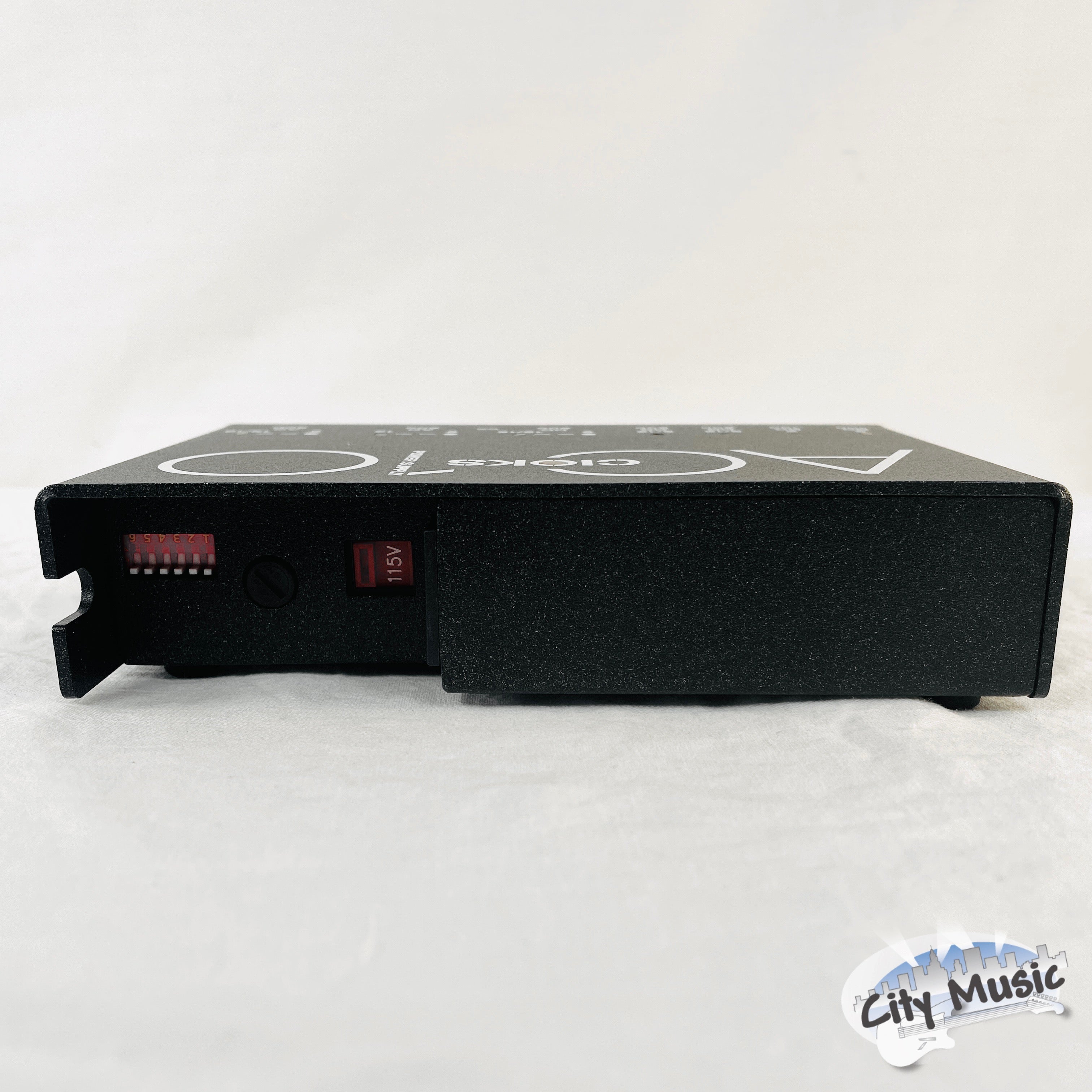 CIOKS AC10 power supply — side view of black enclosure