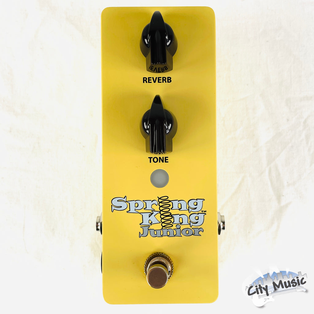 Used Danelectro Spring King Junior yellow reverb pedal — angled view