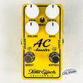 Xotic AC Booster V2 overdrive pedal — yellow enclosure, white knobs, top view