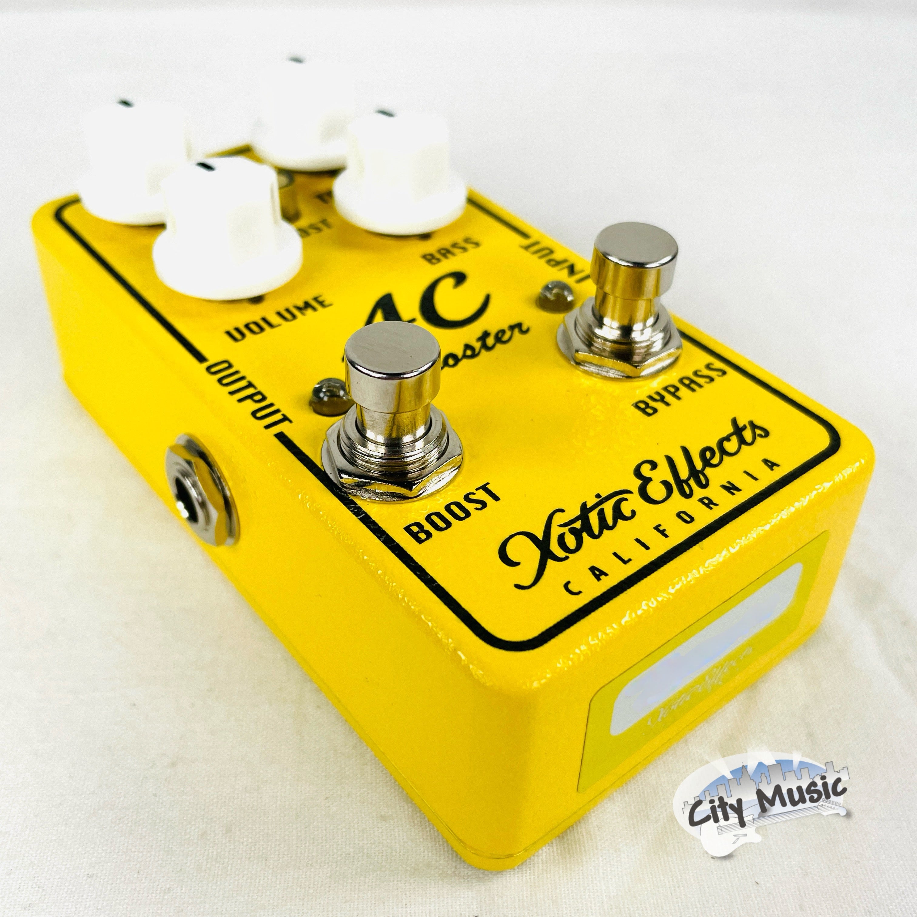 Xotic AC Booster V2 overdrive pedal — yellow, front view