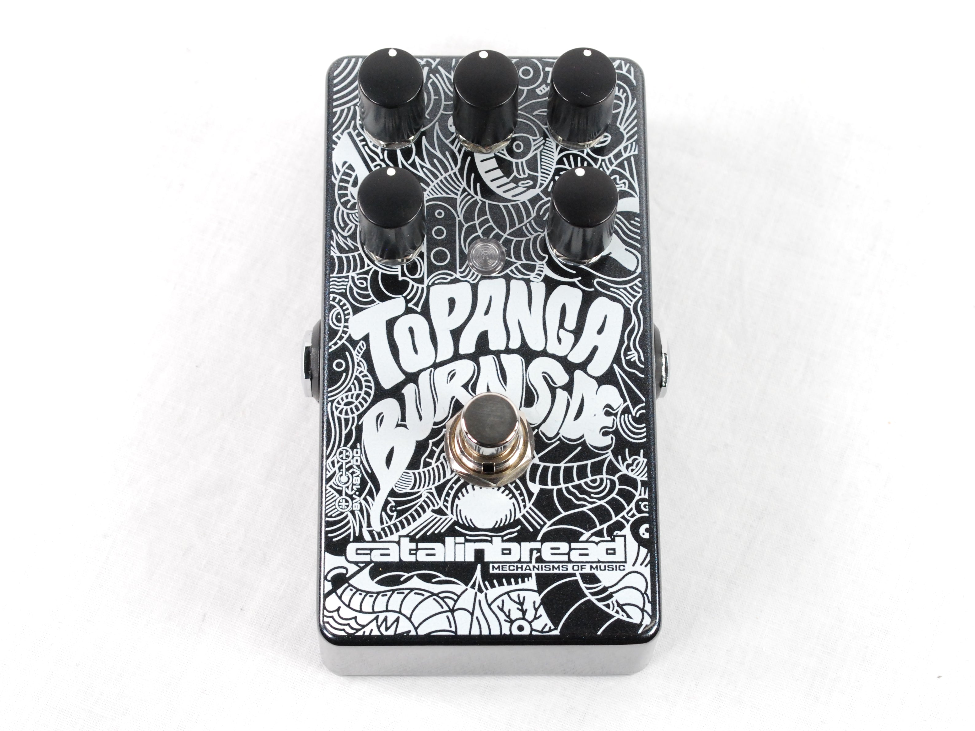 Used Catalinbread Topanga Burnside reverb tremolo pedal — black enclosure with white artwork, top view