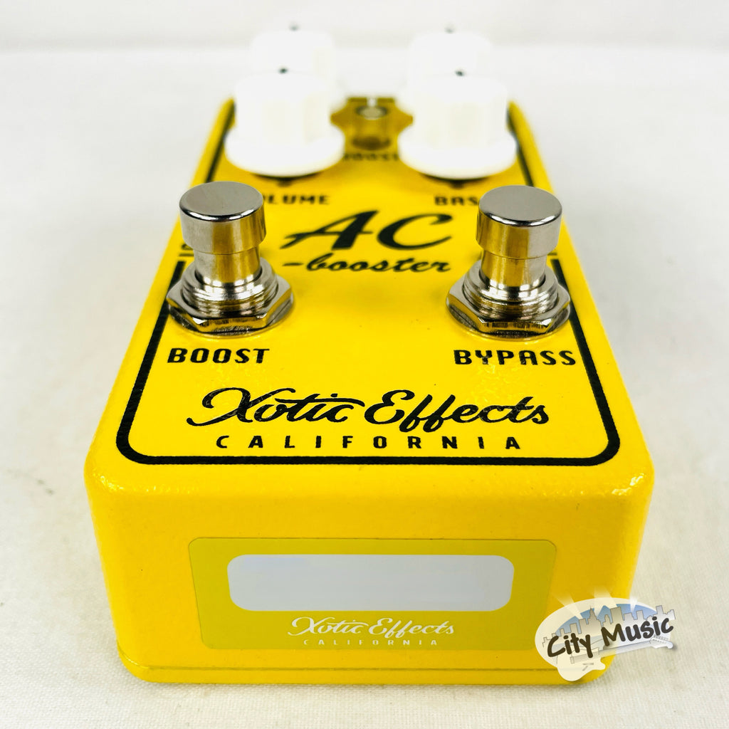 Xotic AC Booster V2 pedal — yellow, angled view