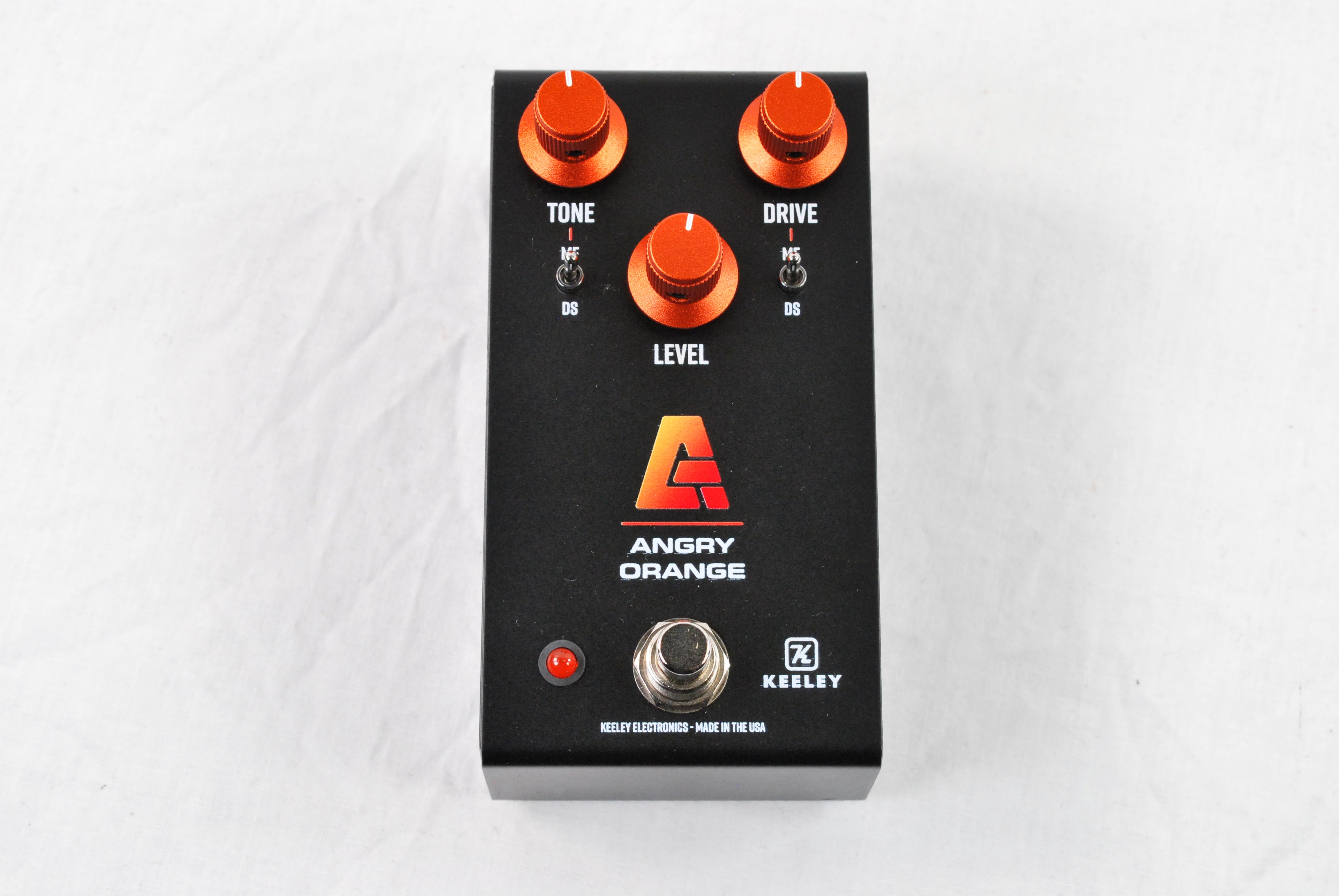 Used Keeley Angry Orange distortion fuzz pedal — black enclosure top view