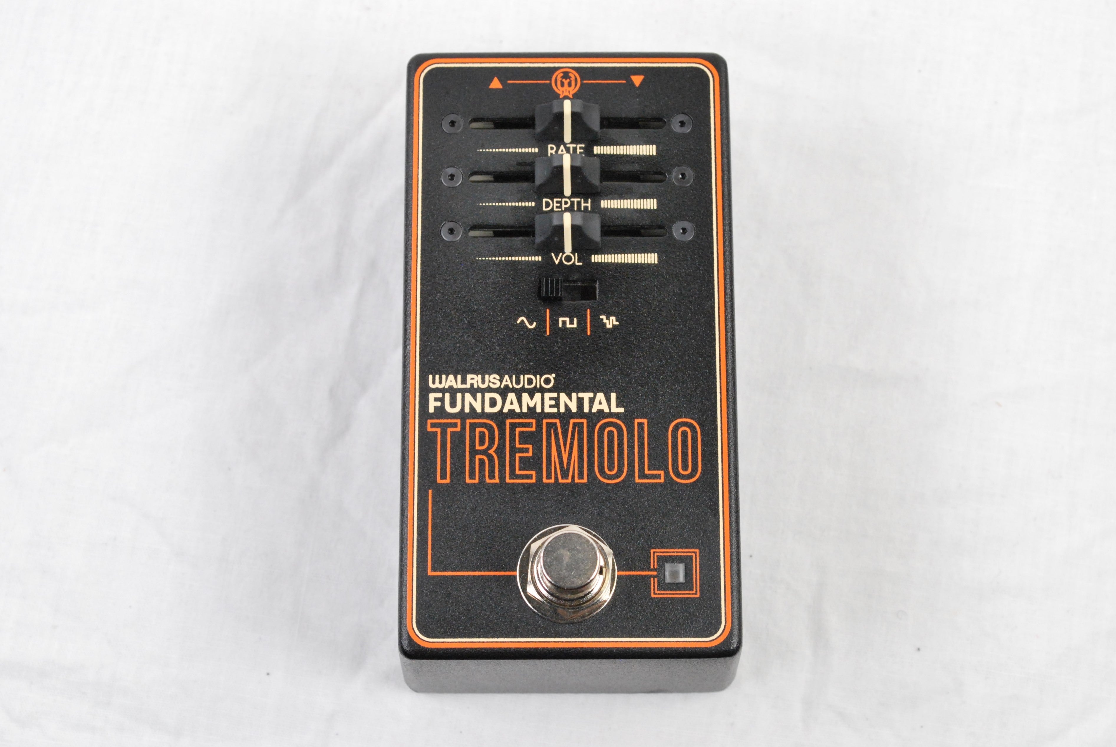 Walrus Audio Fundamental Tremolo guitar effects pedal — angled top view on cloth