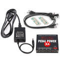 Voodoo Lab Pedal Power X4 power supply — black unit with AC adapter and DC cables