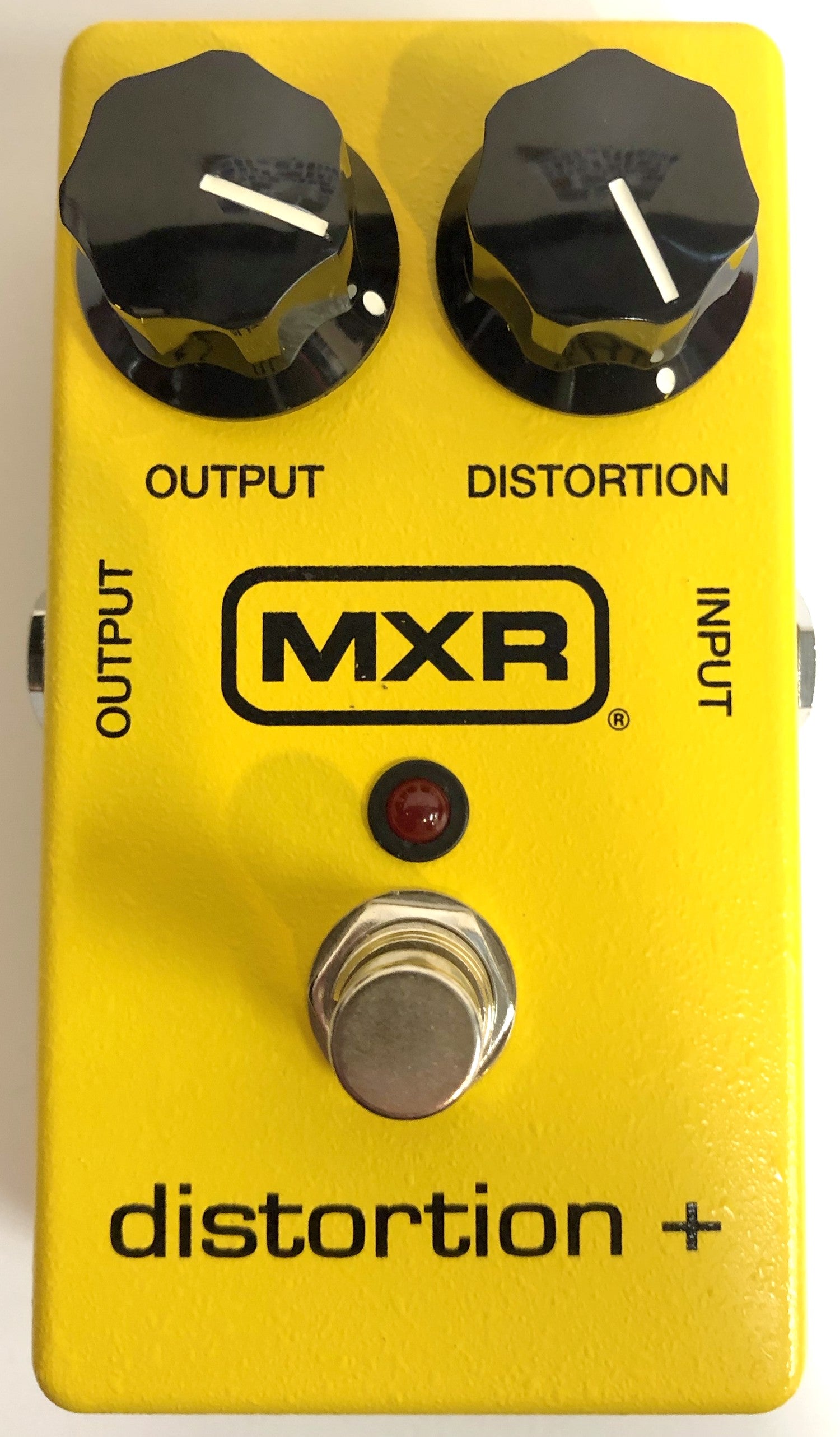 MXR M104 Distortion+ pedal — yellow enclosure top view used