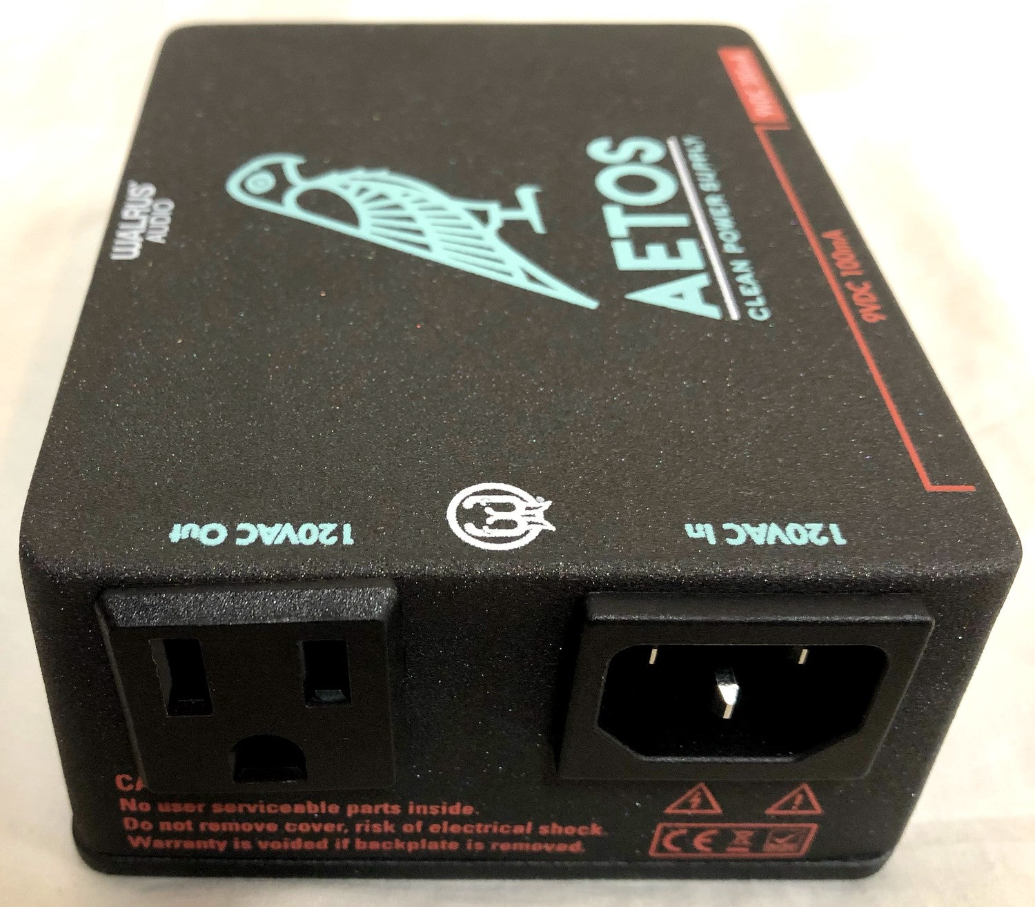 Walrus Audio Aetos V2 power supply — angled view of black enclosure