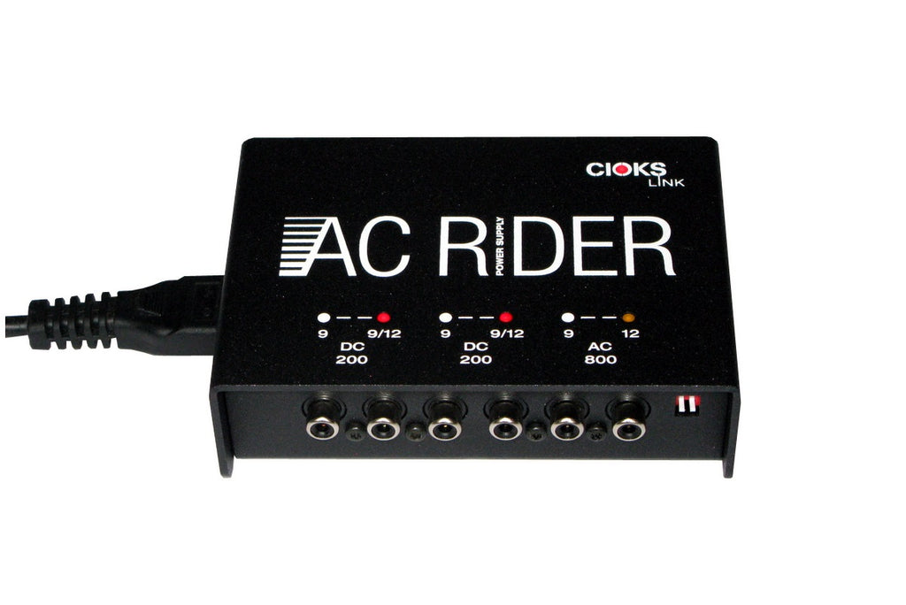 Cioks AC Rider Link power supply — angled view of output jacks and indicator LEDs