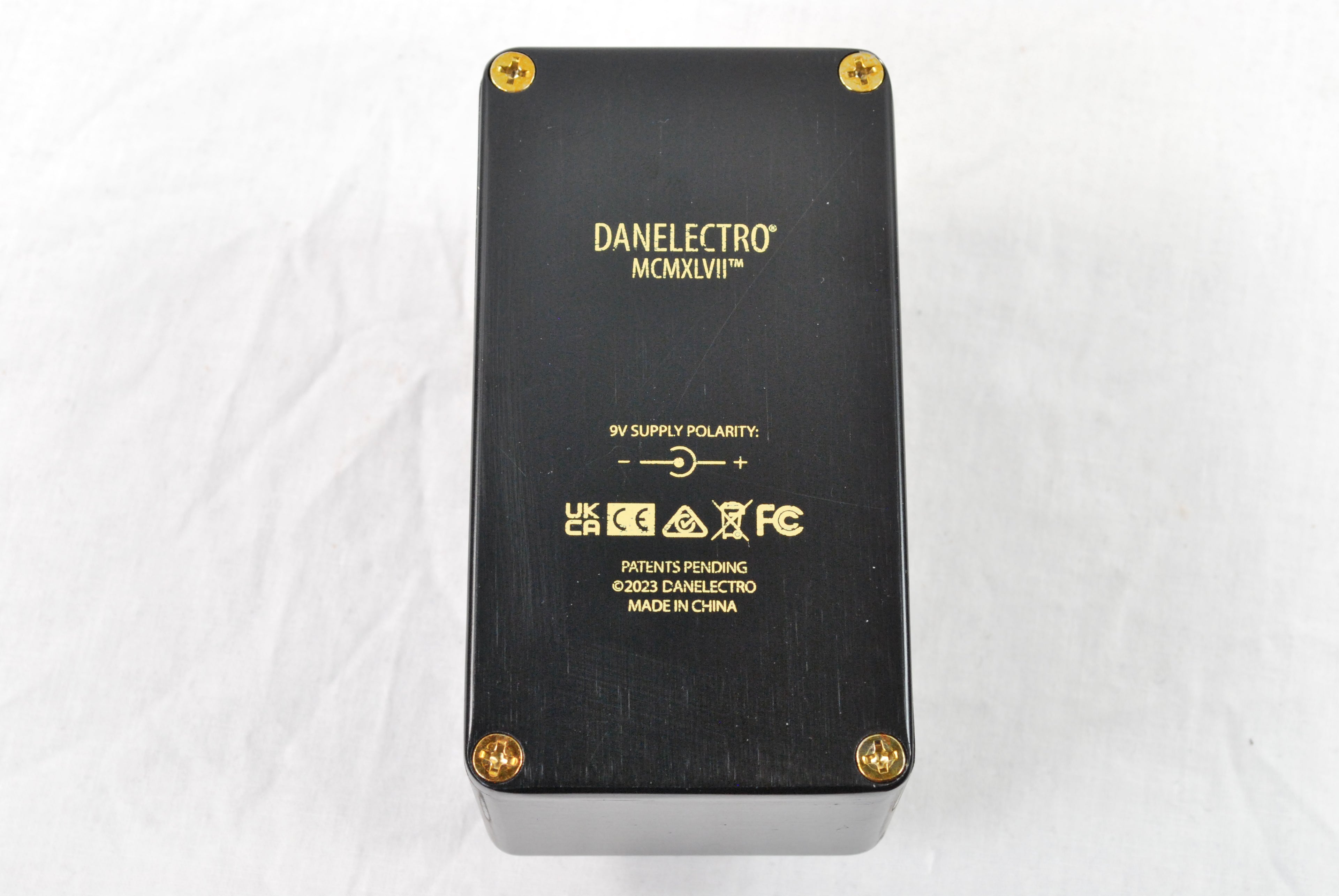 Danelectro N-66 Nichols 1966 fuzz pedal — black, side profile view