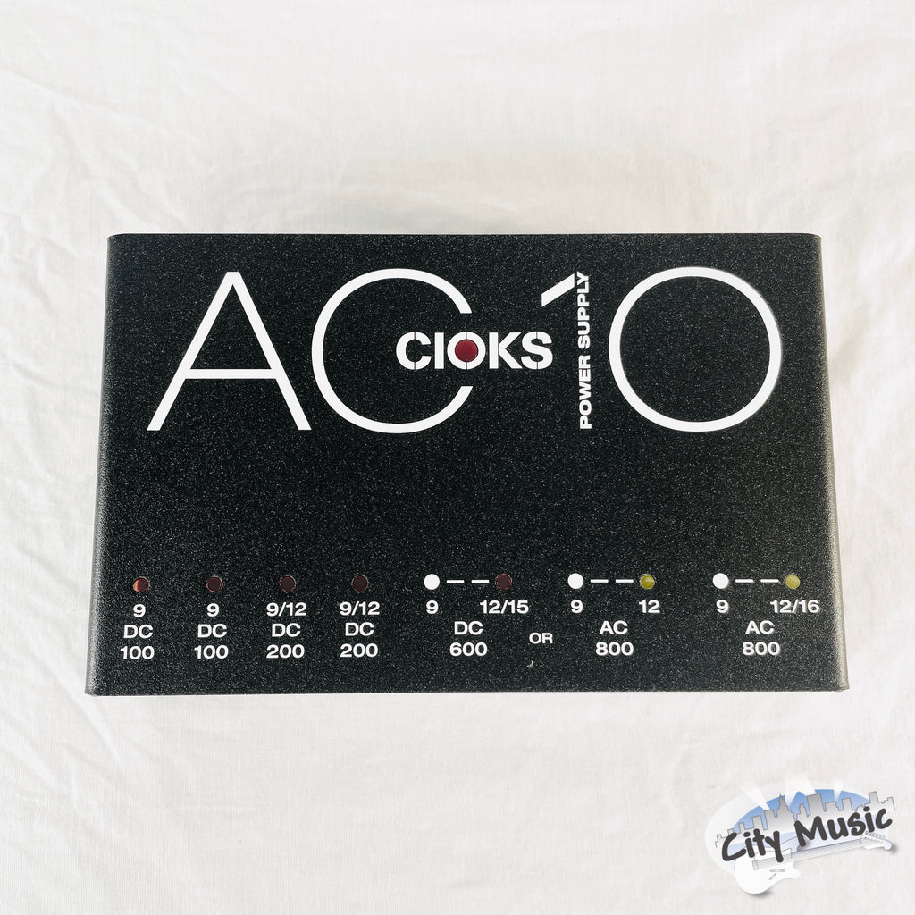 Used CIOKS AC10 pedal power supply — black enclosure top view with AC10 branding