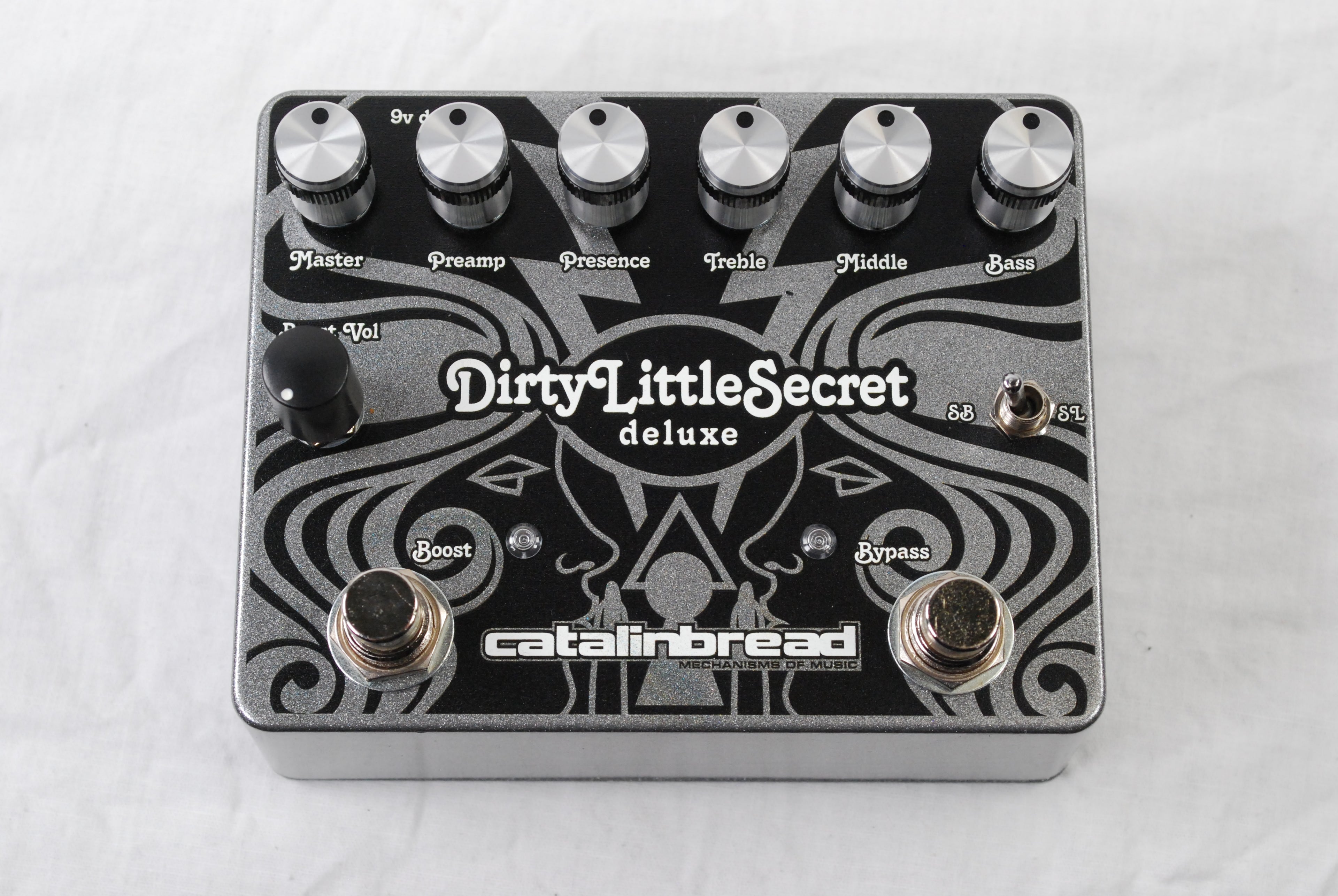 Catalinbread Dirty Little Secret Deluxe overdrive pedal — angled view of controls and footswitches