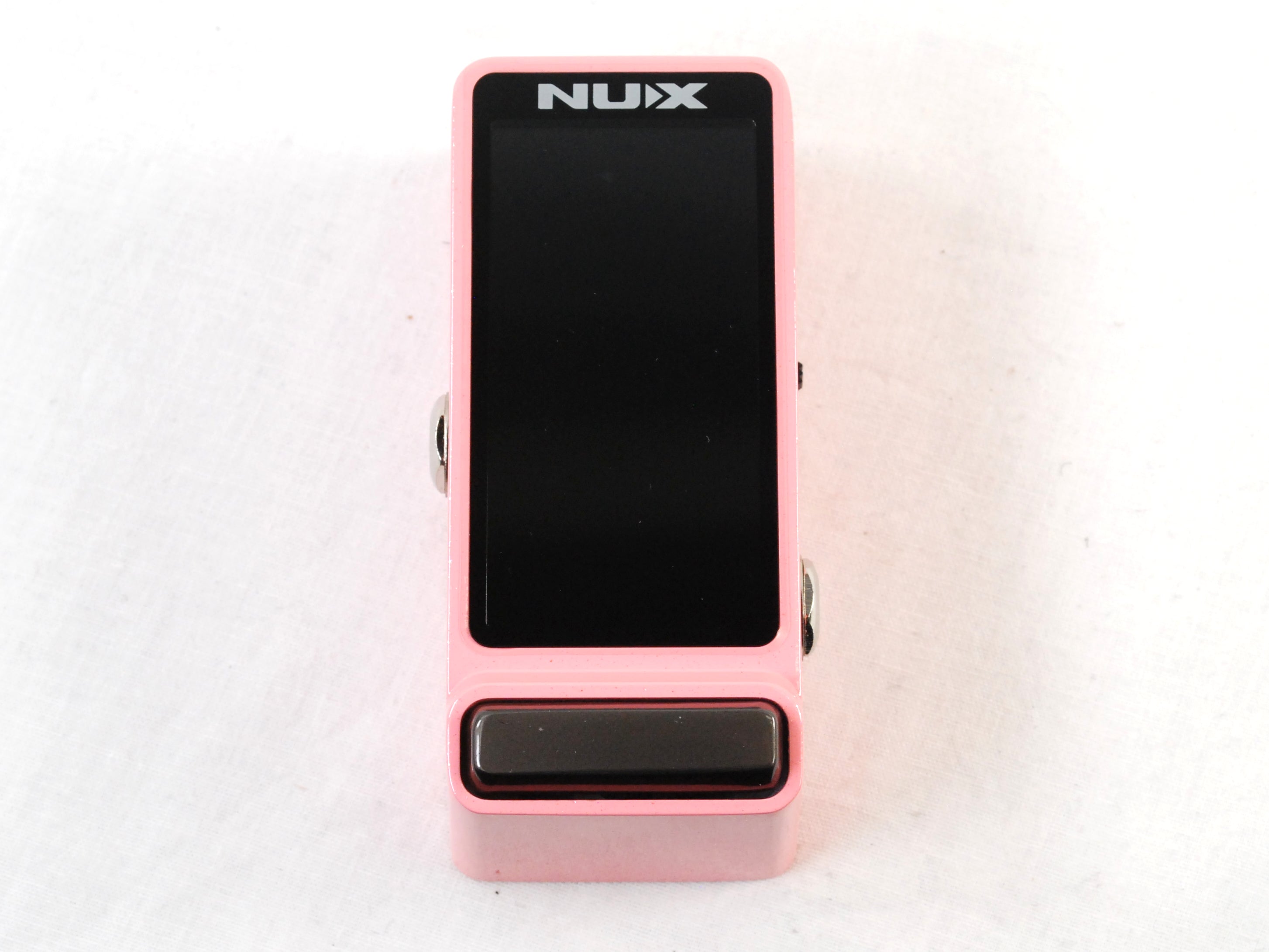 Used NUX NTU-3 Flow Tune mini guitar tuner — pink enclosure, front display view