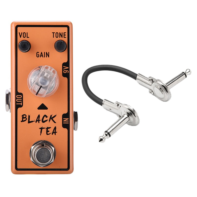 Tone City Black Tea distortion pedal — orange enclosure with patch cable