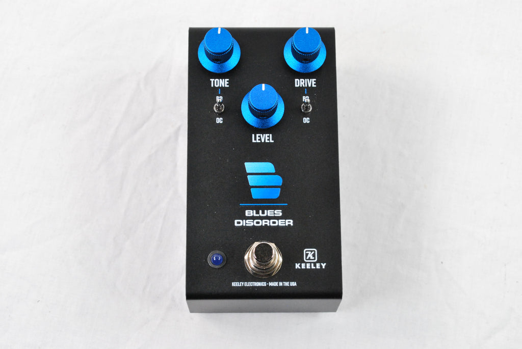 Used Keeley Blues Disorder overdrive distortion pedal — black enclosure angled view