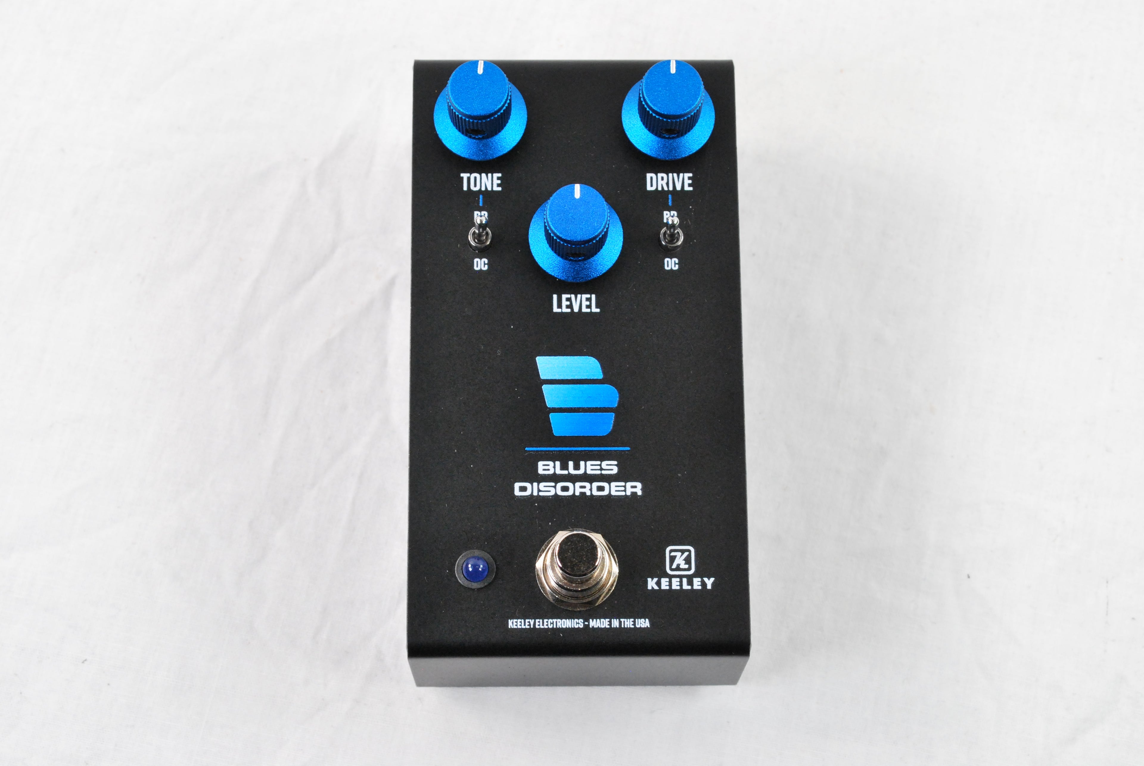 Used Keeley Blues Disorder overdrive distortion pedal — black enclosure angled view