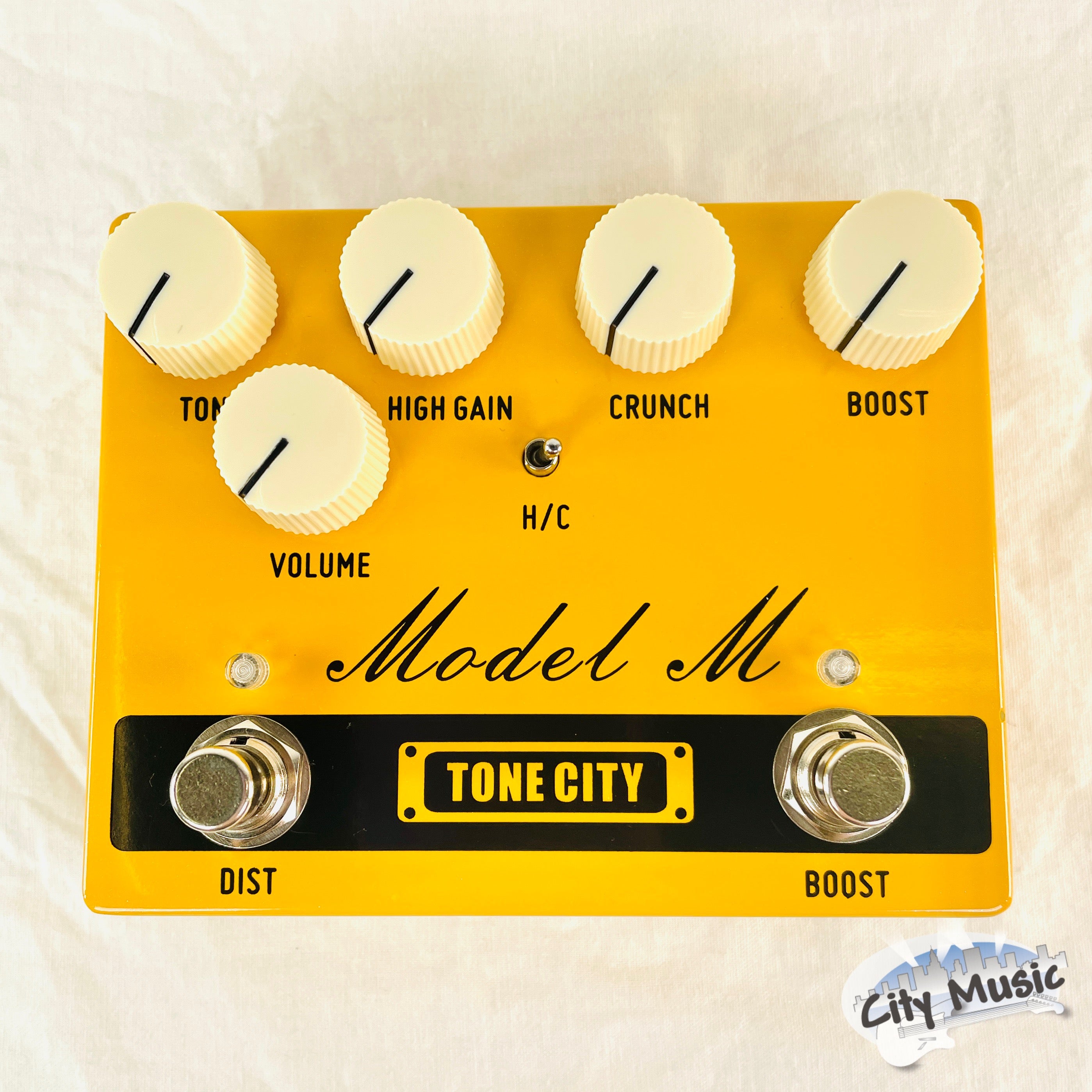 Tone City TC-T32 Model M distortion pedal — top view, yellow