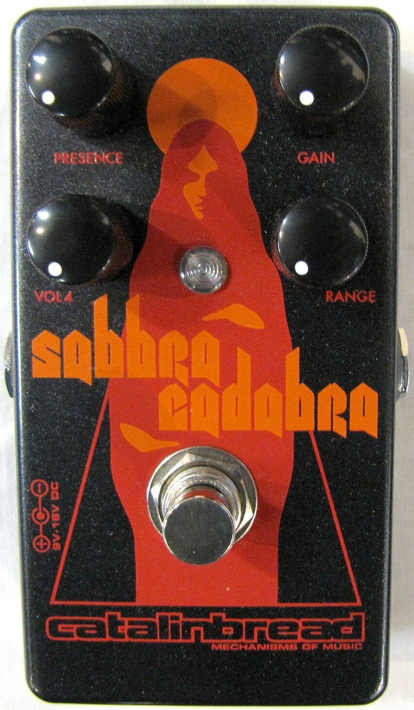 Catalinbread Sabbra Cadabra treble boost pedal — front view, black with orange art