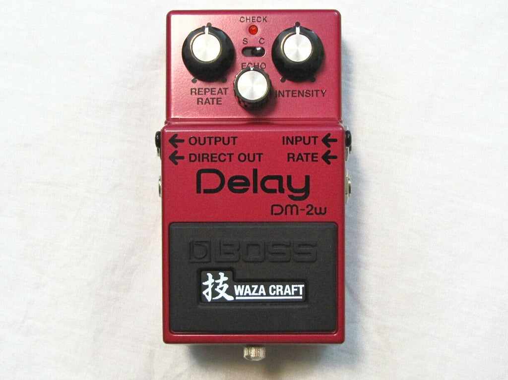Used Boss DM-2W Waza Craft analog delay pedal, red, top view with knobs