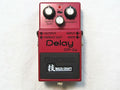 Used Boss DM-2W Waza Craft analog delay pedal, red, top view with knobs