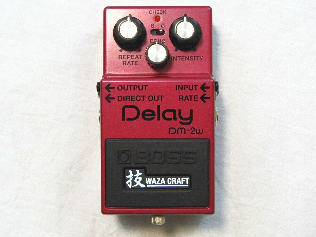 Used Boss DM-2W Waza Craft analog delay pedal, red, top view with knobs