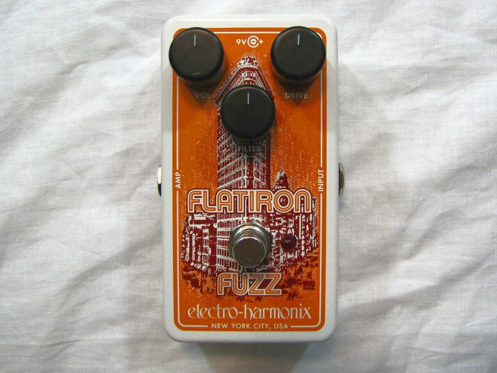 Electro-Harmonix Flatiron Fuzz guitar pedal — front view, orange and white enclosure