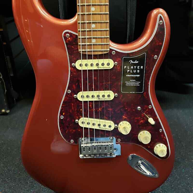 Fender Player Plus Stratocaster electric guitar — Aged Candy Apple Red body front