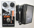 Electro-Harmonix Pitch Fork white polyphonic pitch shifter pedal shown with included AC adapter