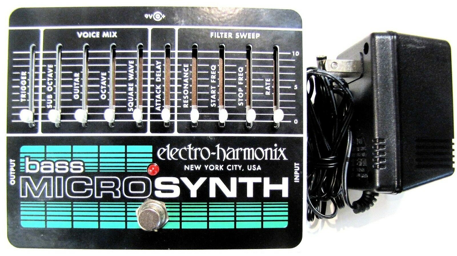 Electro-Harmonix Bass Micro Synthesizer pedal — black enclosure with sliders and power supply