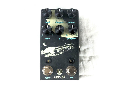 Walrus Audio ARP-87 Multi-Function Delay pedal — top view, black enclosure with spacecraft artwork