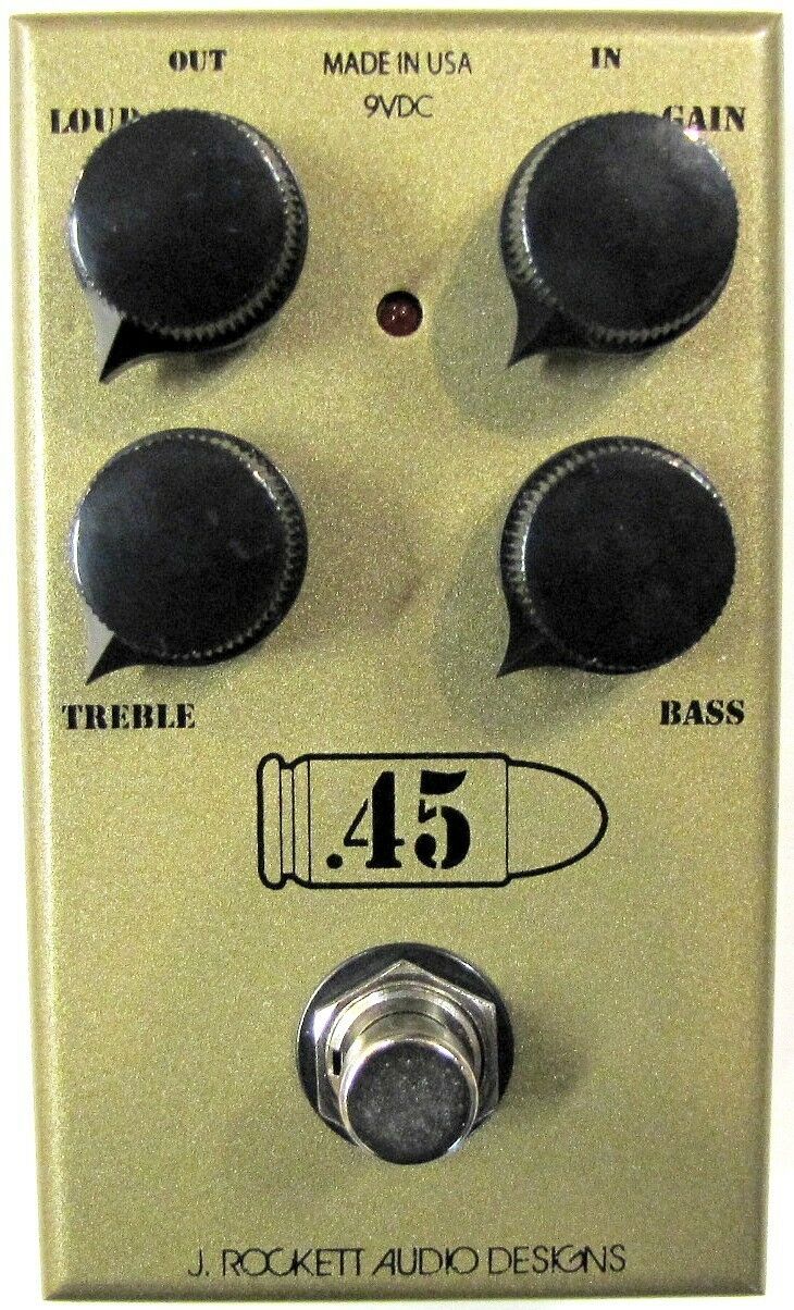 J Rockett 45 Caliber overdrive pedal — gold enclosure with four black knobs, top view