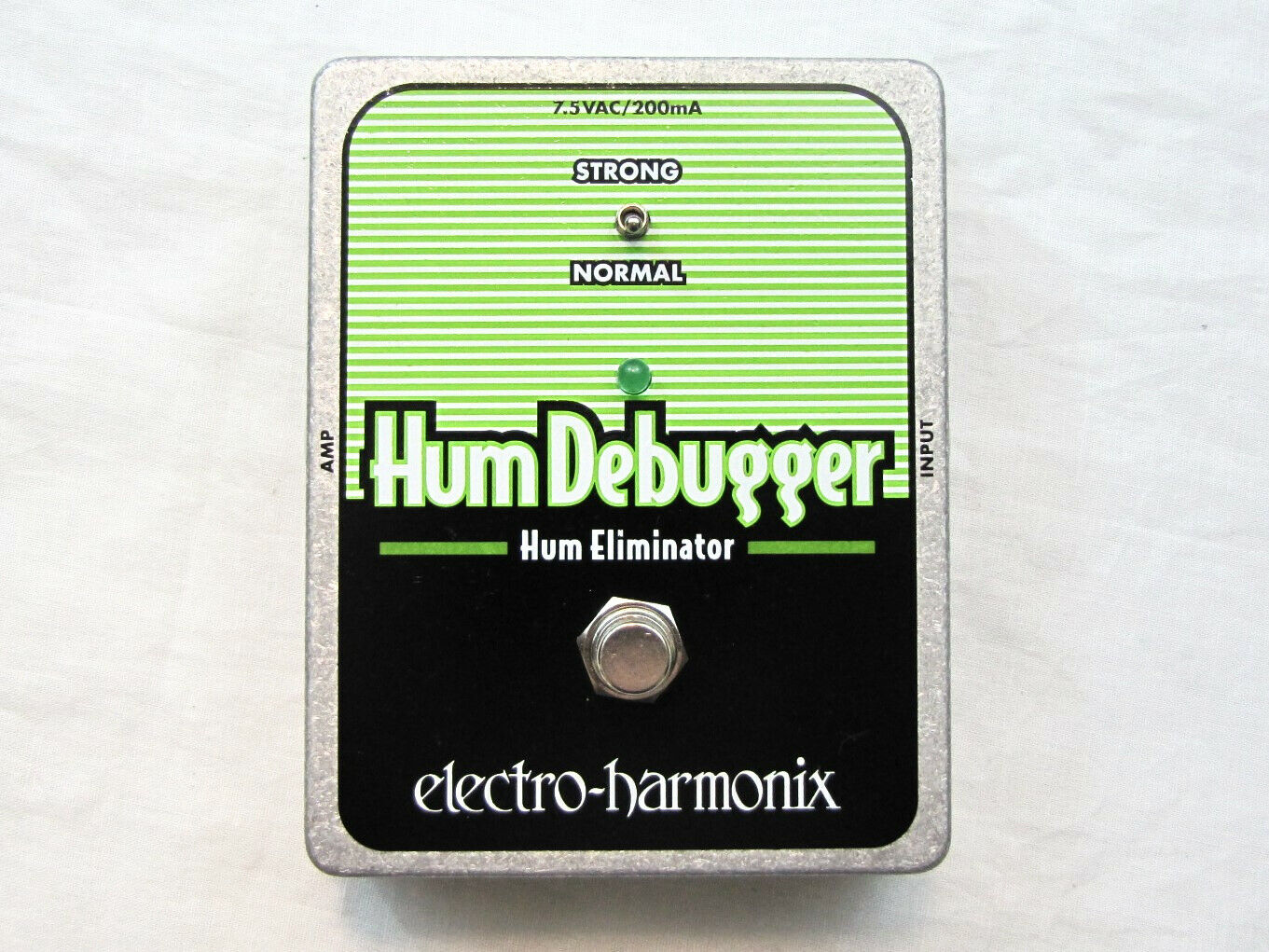 Electro-Harmonix Hum Debugger pedal — black face, silver edges, strong/normal switch