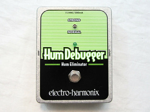 Electro-Harmonix Hum Debugger pedal — black face, silver edges, strong/normal switch