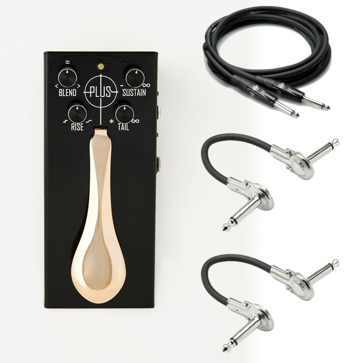 Gamechanger Audio Plus Pedal sustain effect — black enclosure with wooden treadle and cables