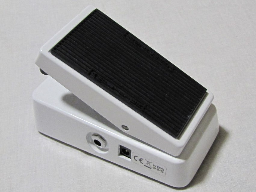 Dunlop Cry Baby Mini CBM105Q bass wah pedal — silver enclosure angled view of treadle and base